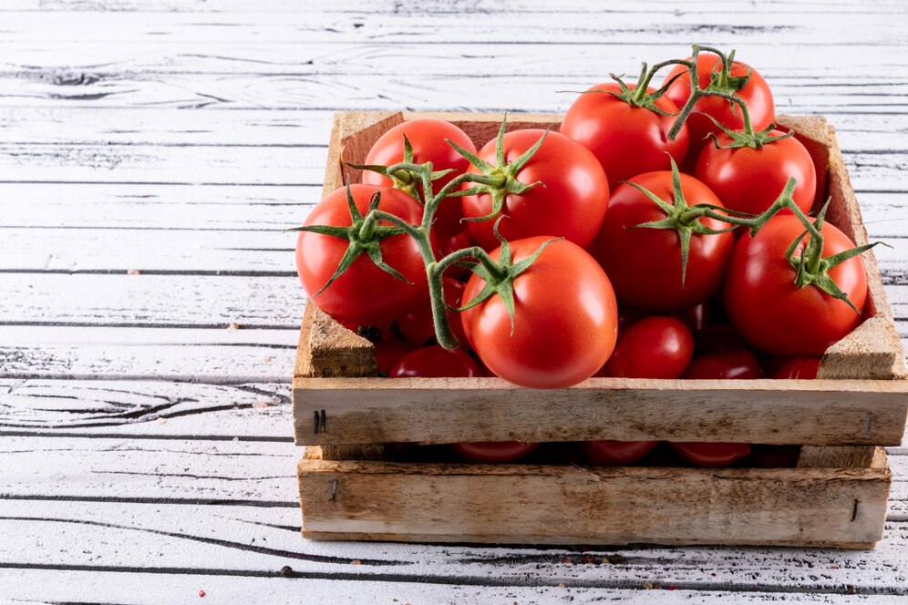 wooden-box-full-red-tomatoes-white-wood_176474-148